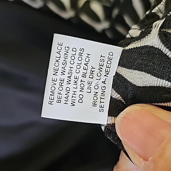 My collection is a woman's 2X black and white classic top. Connected tank. - Picture 8 of 8